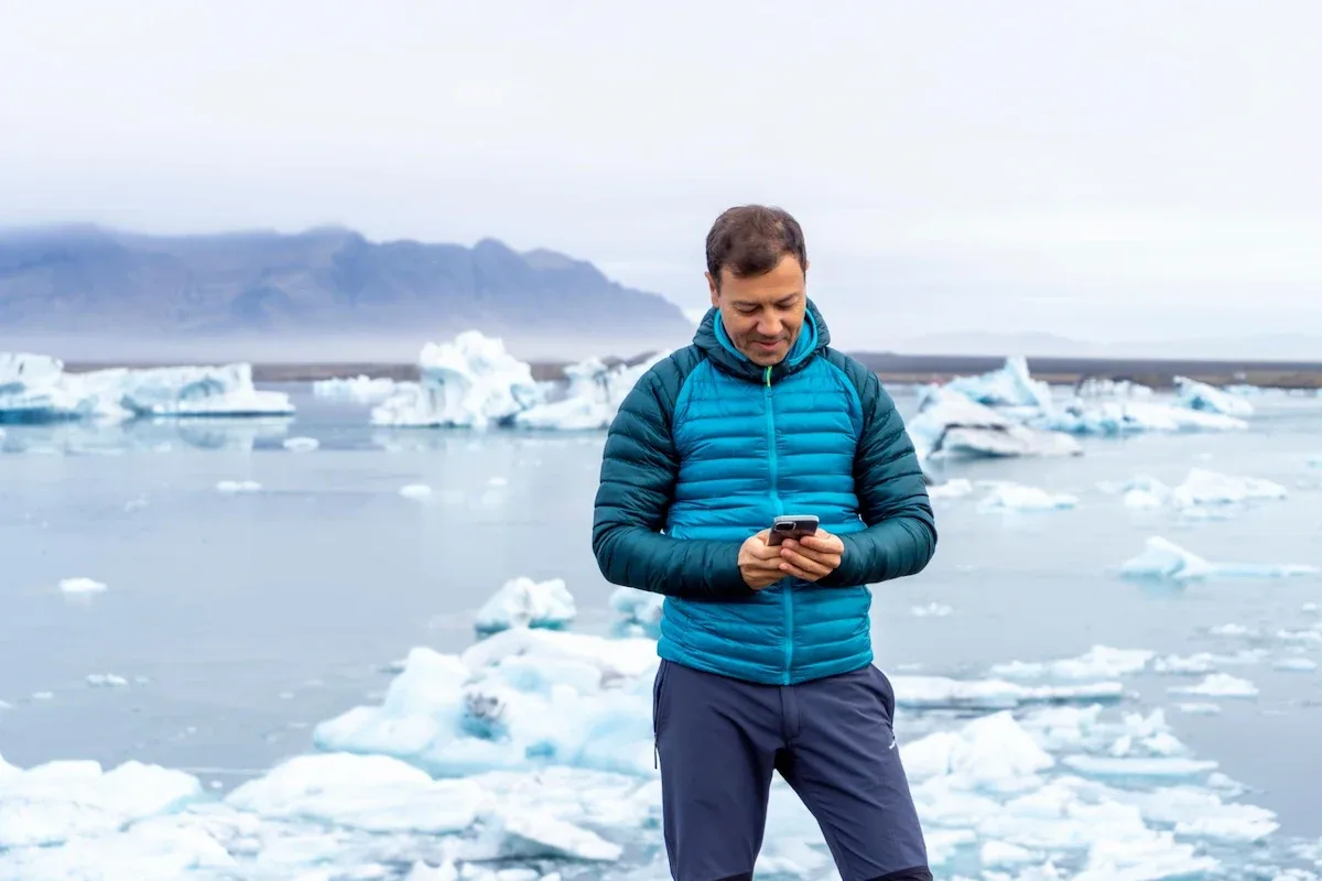 tourist using portable WiFi in Iceland to access mobile internet