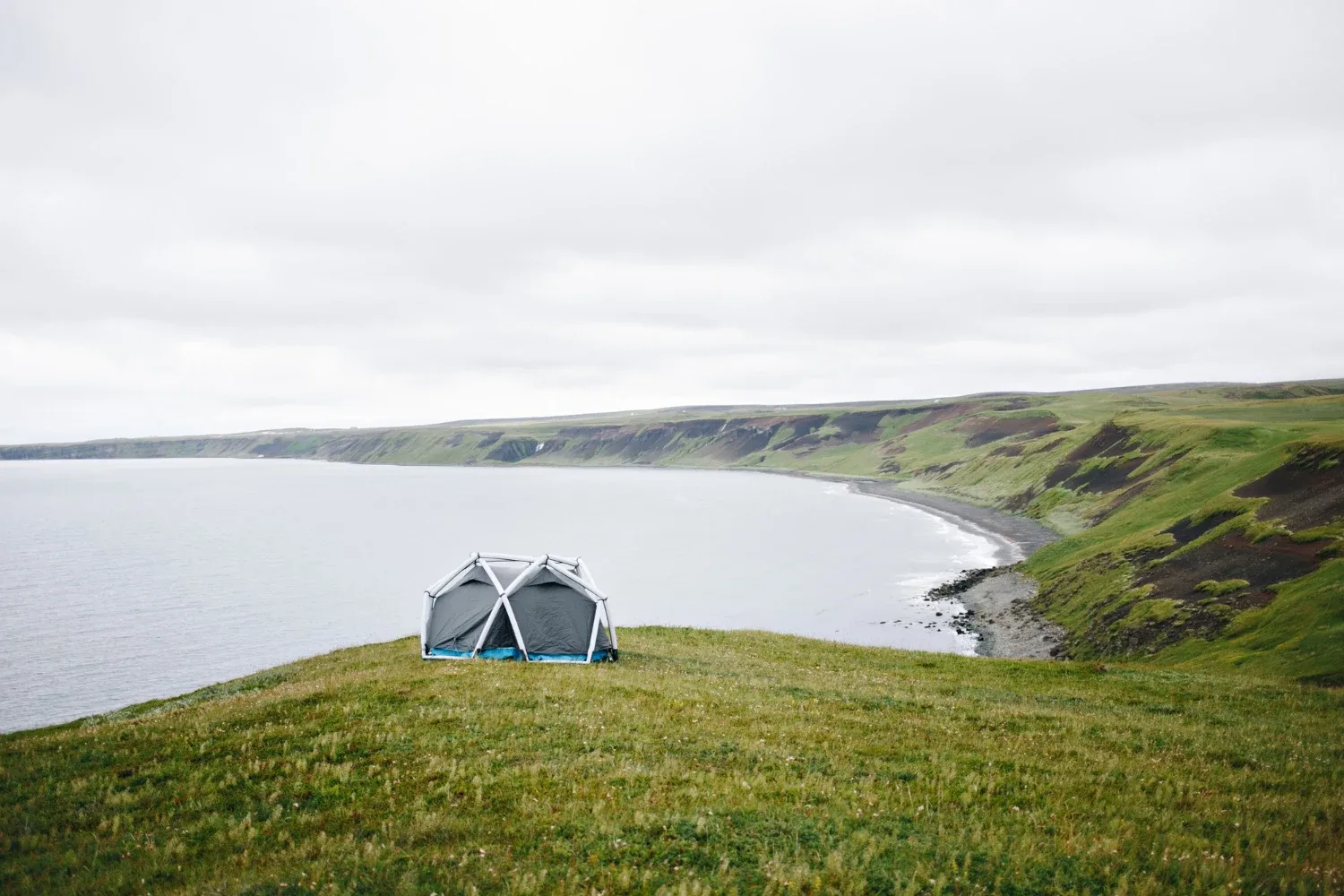 Iceland campsite with Foxie Campers campervan parked on grass in the mountains