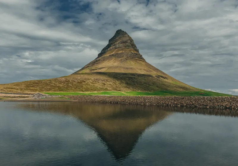 Kirkjufell mountain mirrored in the water