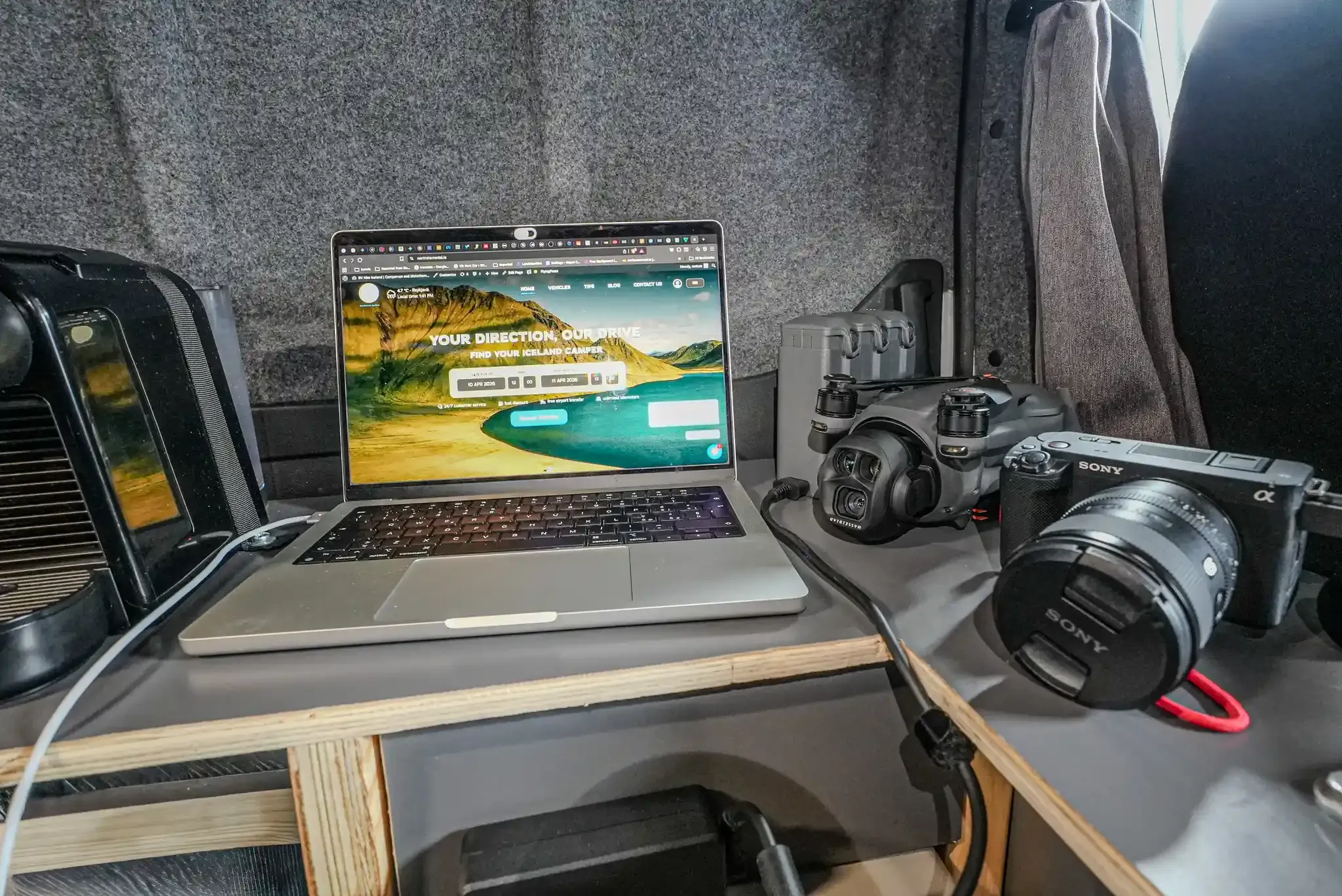 Off-grid campervan in Iceland with onboard power system charging laptop, drone batteries, camera batteries and phones
