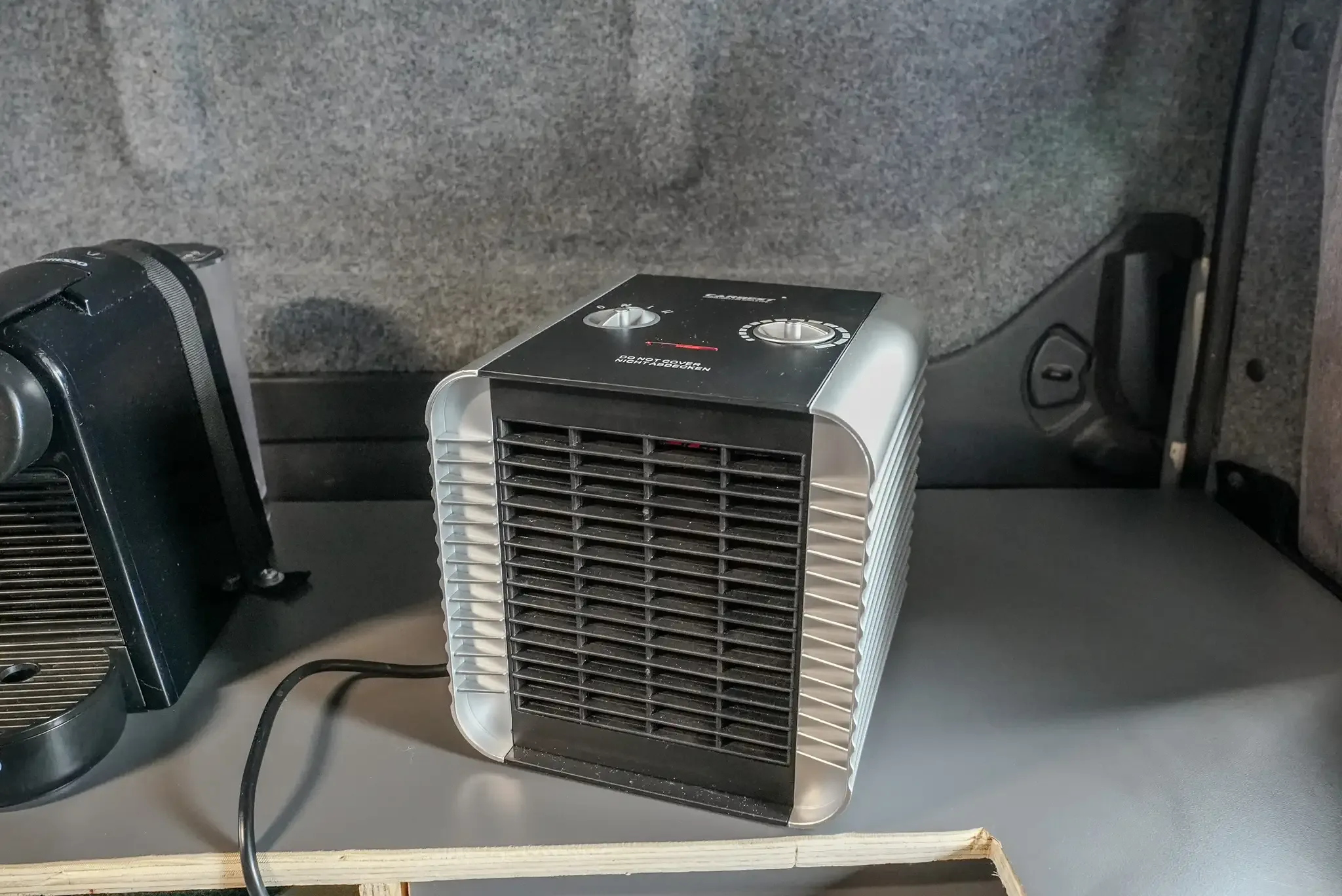 Webasto diesel heater in an off-grid campervan in Iceland used for overnight heating without campsite electricity