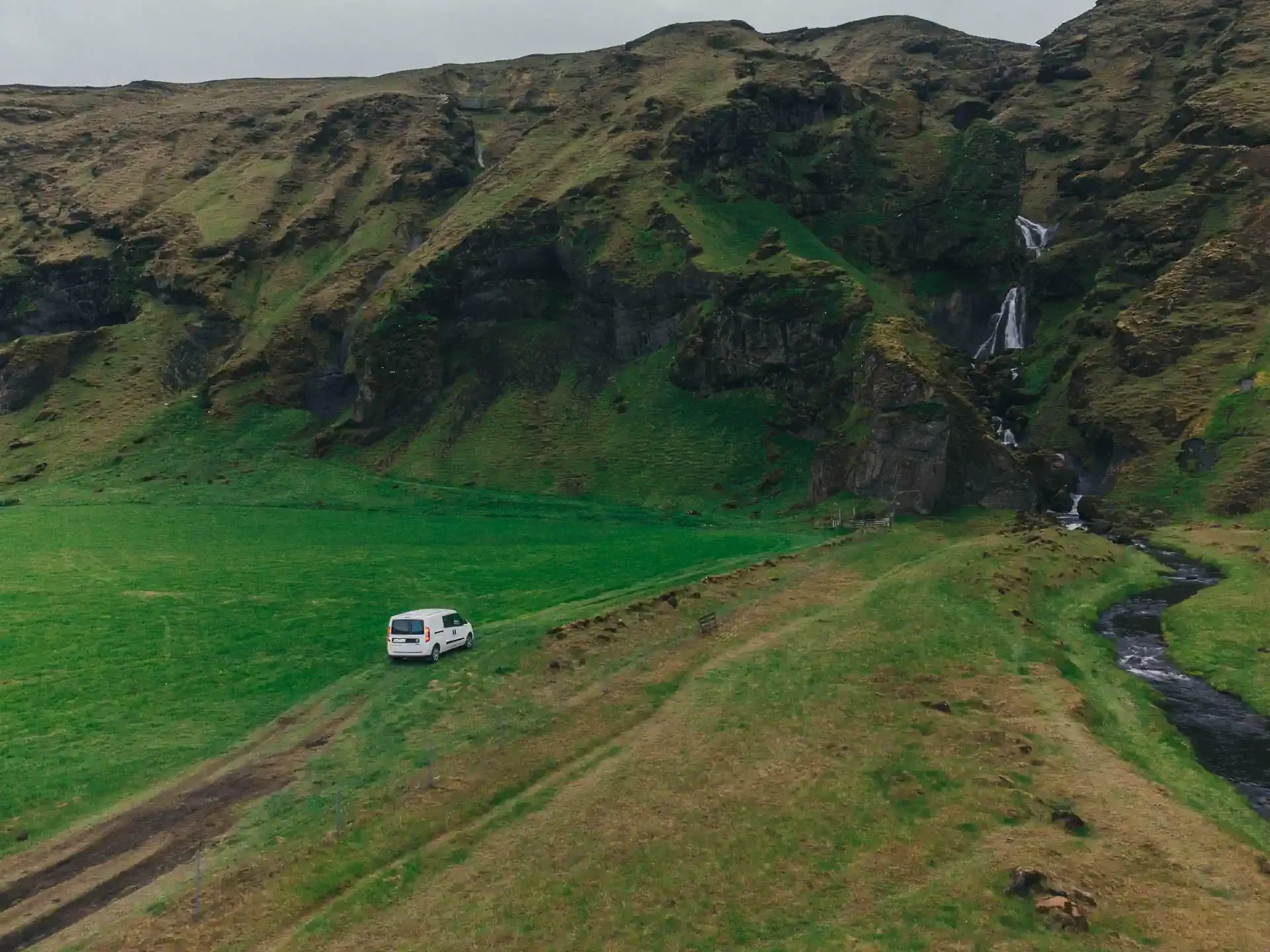 Campervan exploring Icelandic countryside in early spring during Easter road trip