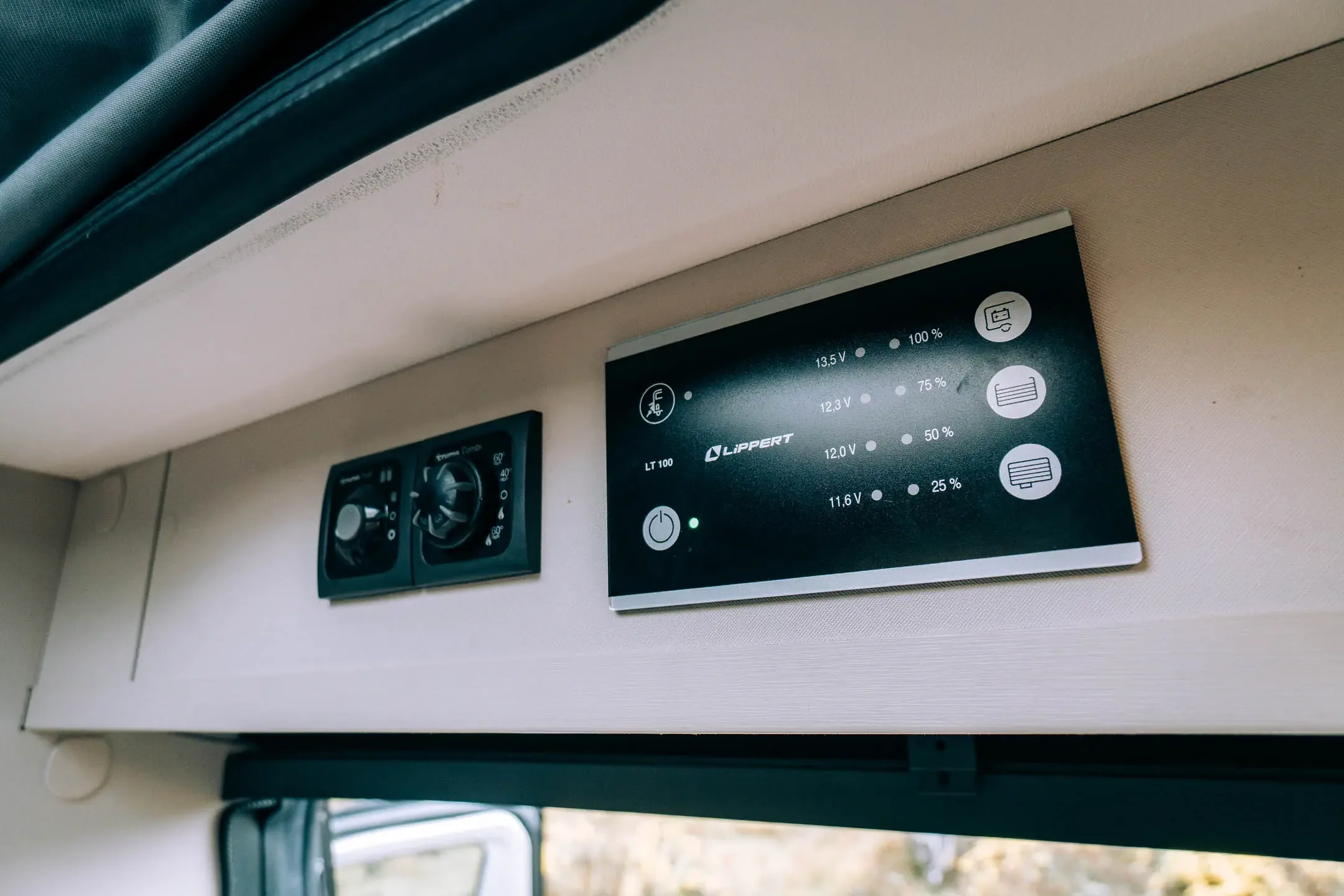 Campervan rental in Iceland showing leisure battery control panel and power levels