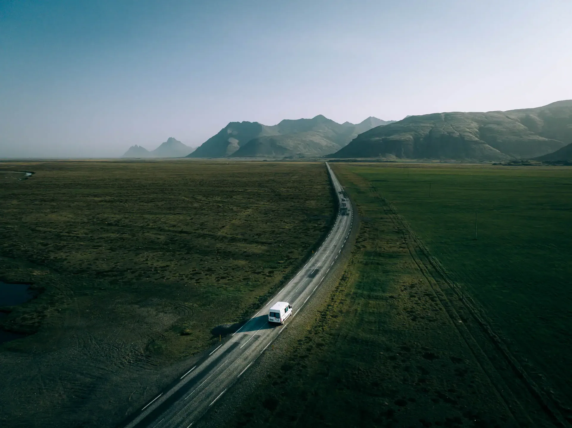 Campervan driving on the Ring Road in Iceland, used to illustrate driver’s license requirements for renting a campervan in Iceland