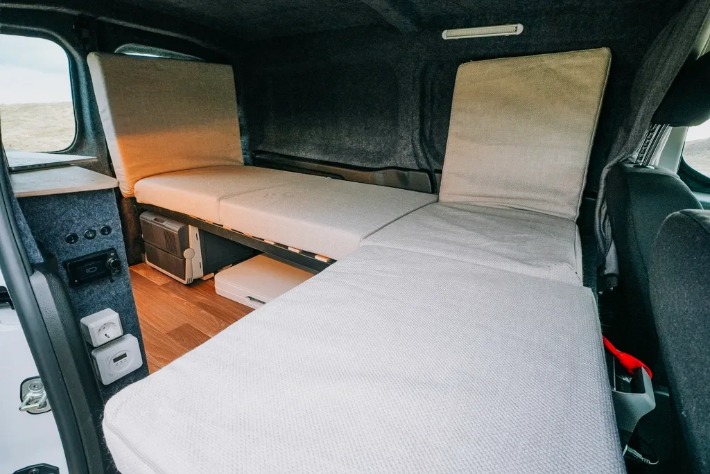 The sofa converts into a 200 cm by 130 cm bed, while keeping the campervan useful as a living space during the day.