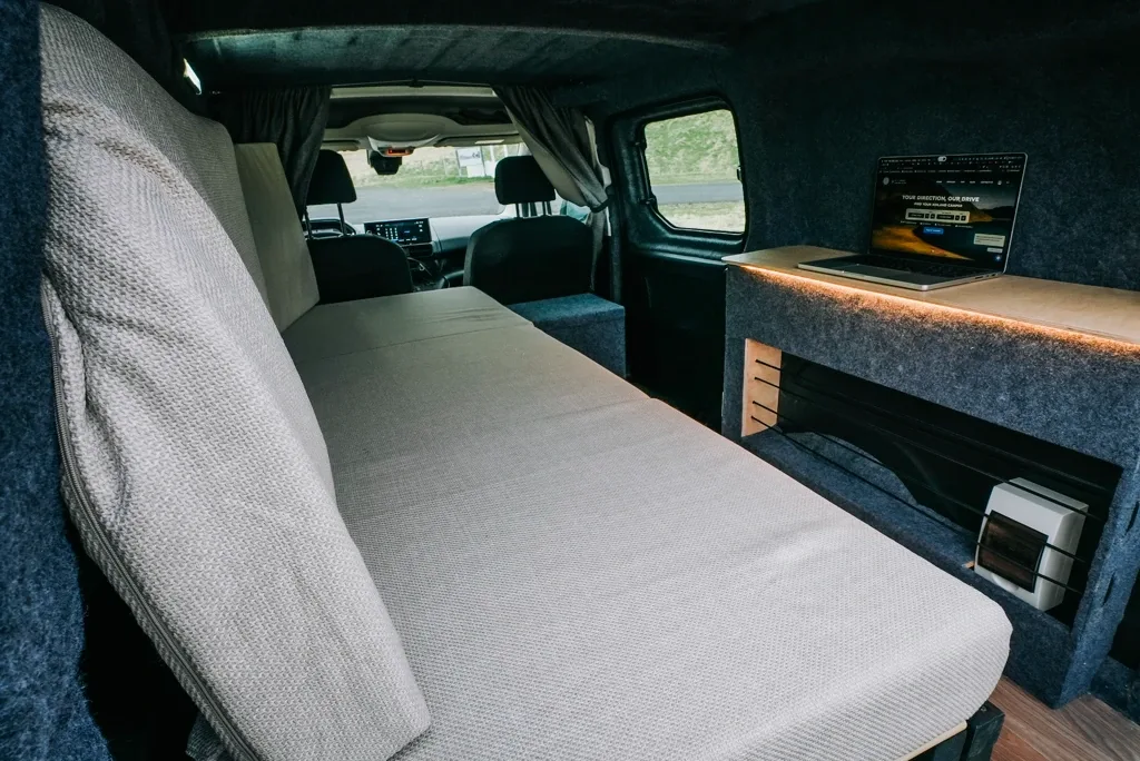 interior of campervan 2 person sofa and table 