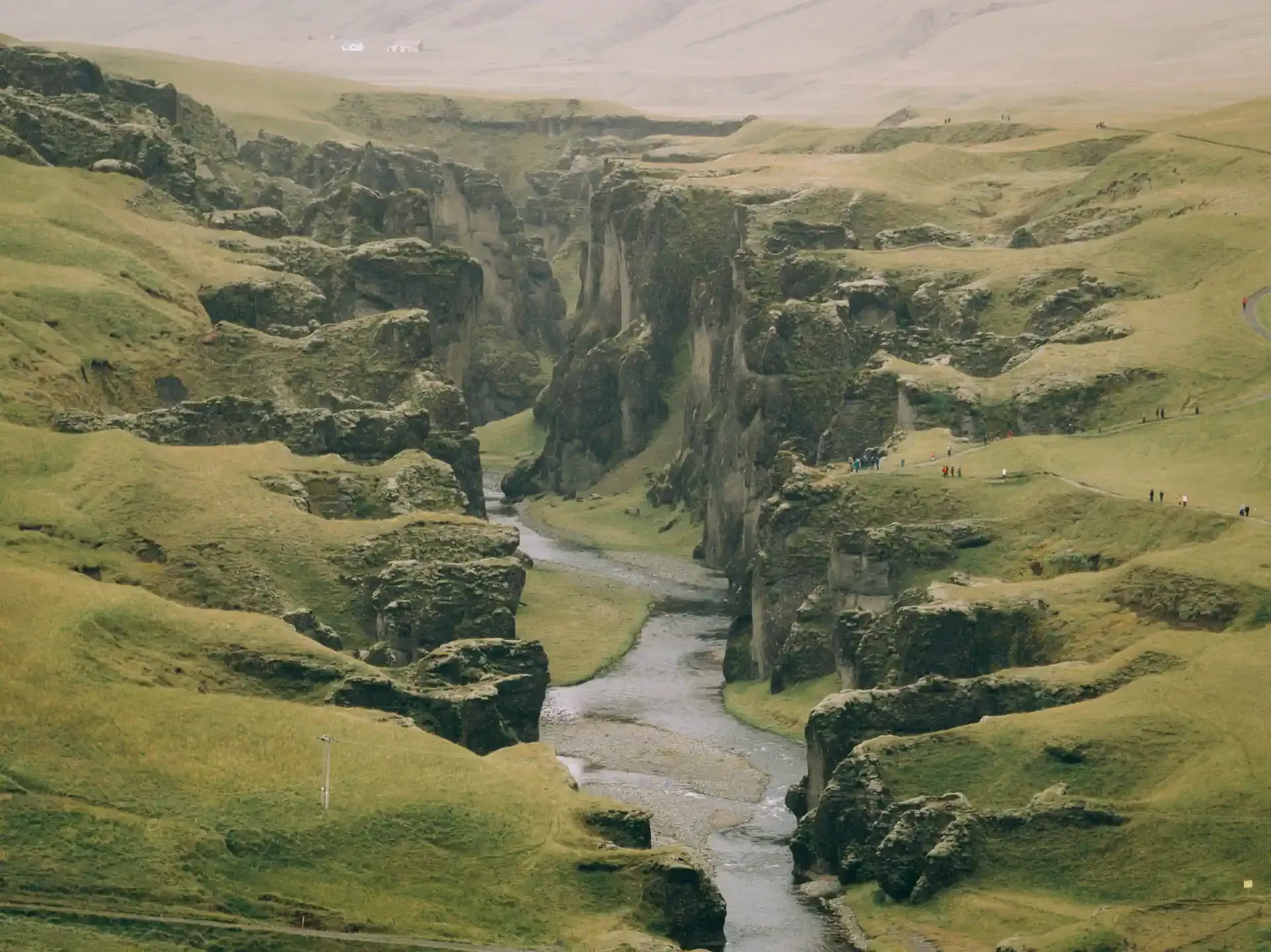 Fjaðrárgljúfur canyon in South Iceland with a winding river between moss-covered cliffs along the Ring Road