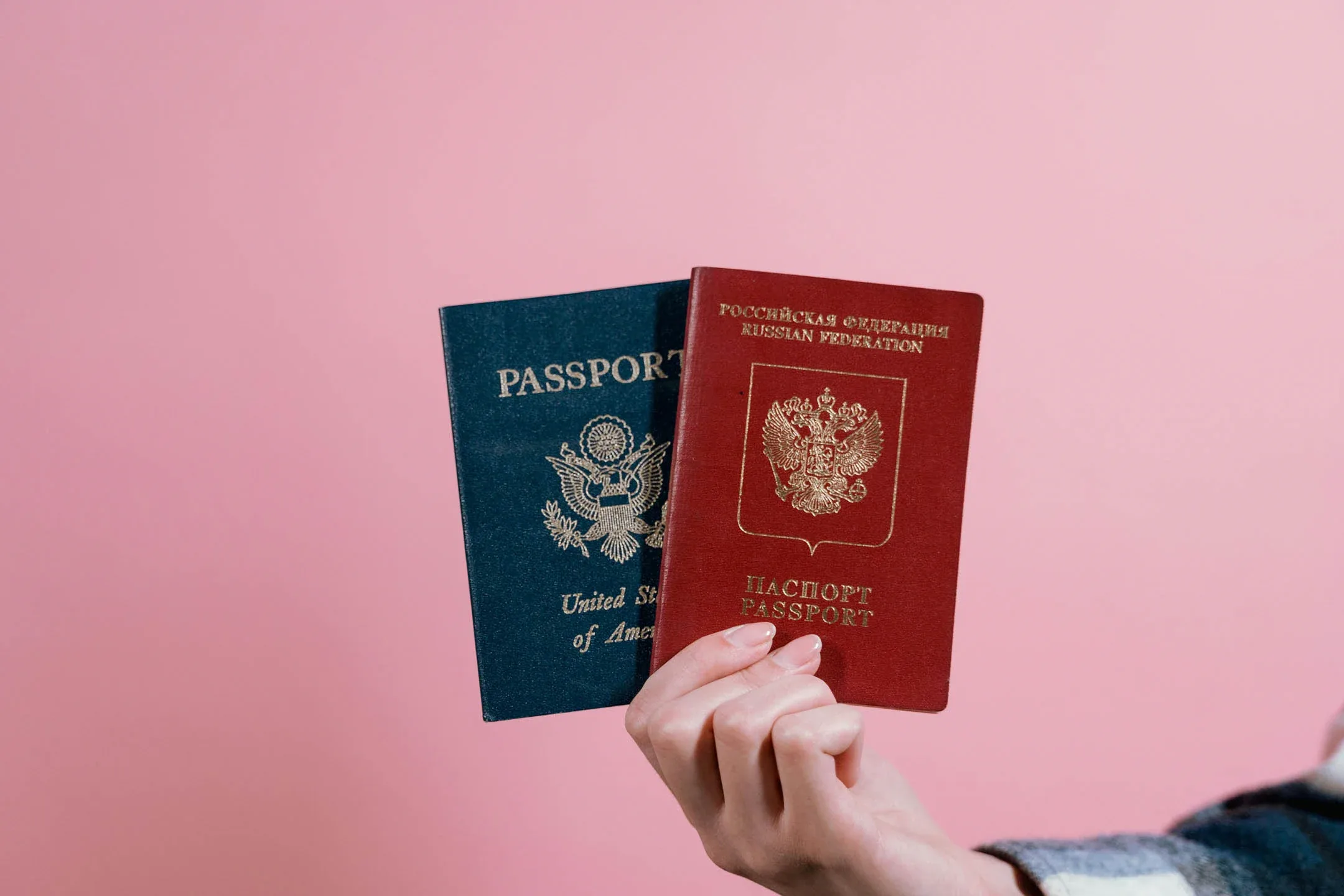 Do I need a visa to travel to Iceland illustrated with USA and Russia passports
