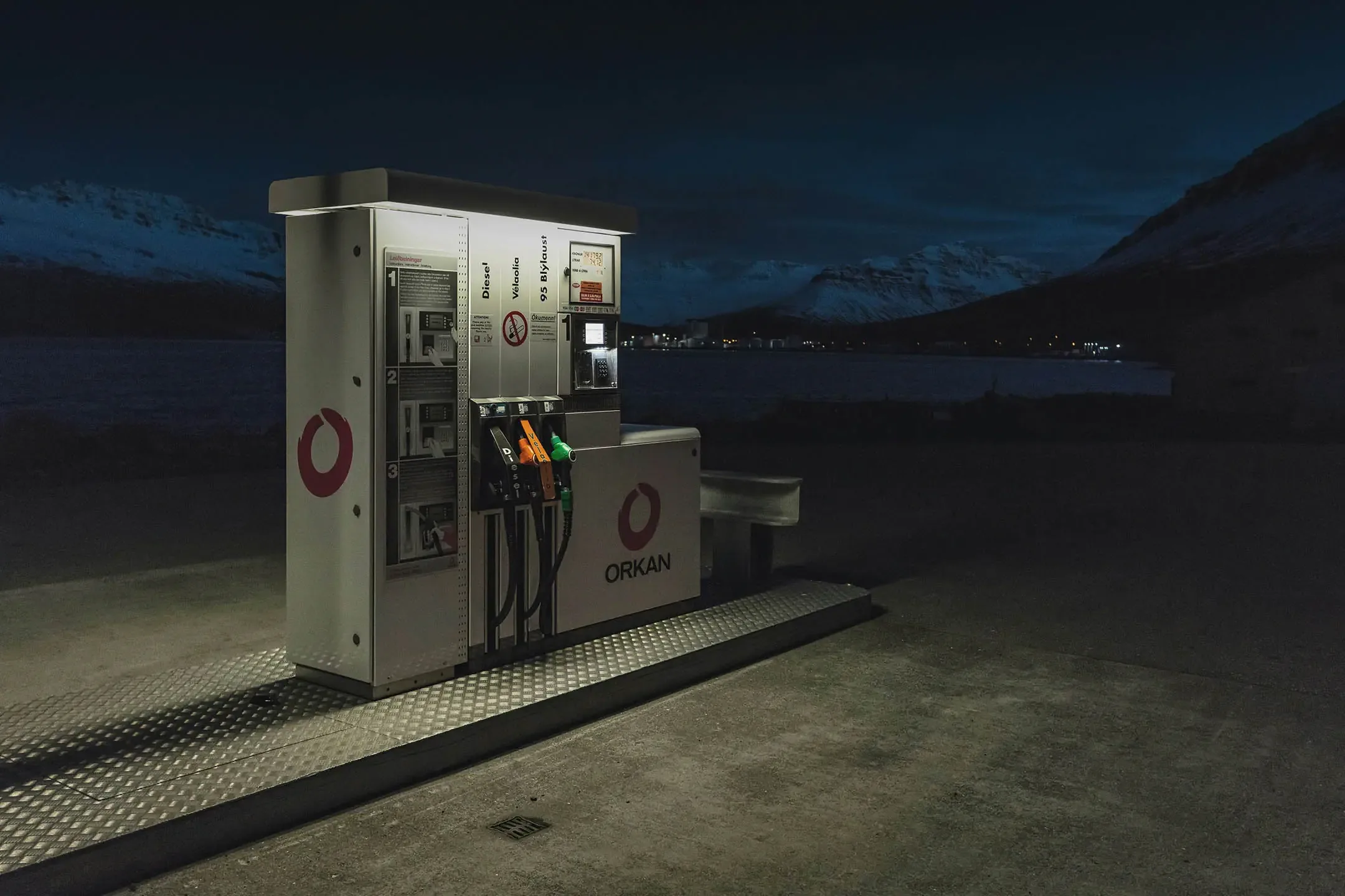 Orkan gas station in Iceland at night with clearly marked diesel and petrol pump handles for campervan travelers