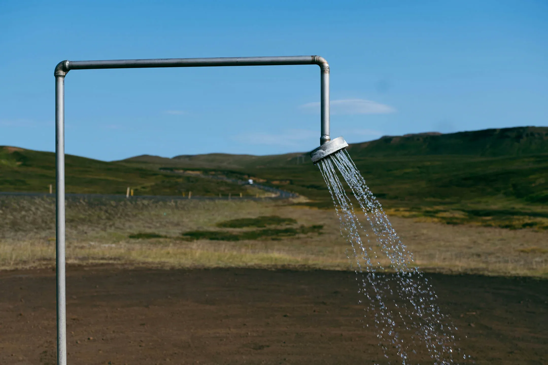 Outdoor geothermal shower near Laugarvatn Golden Circle in Iceland.