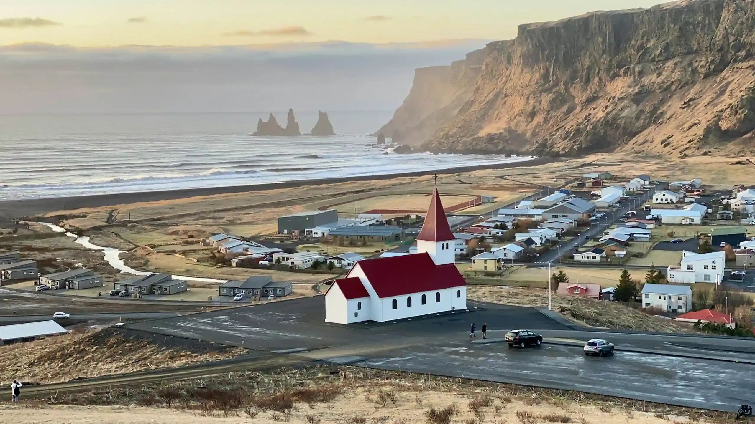 View over Vík village and nearby campsite on Iceland’s south coast, popular with campervans.